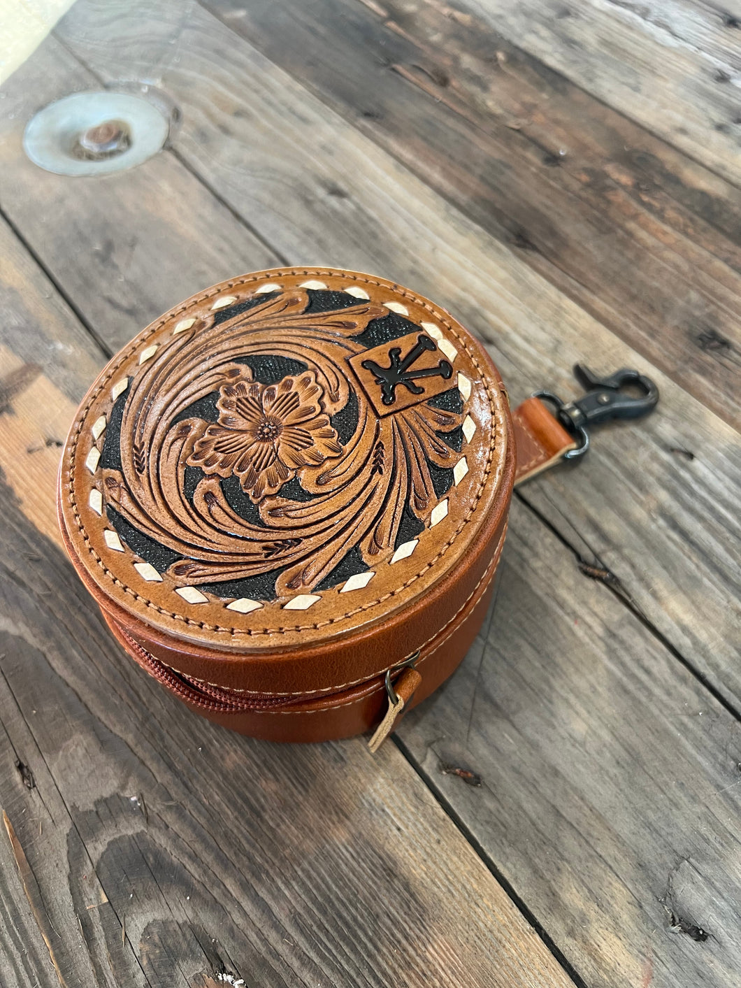 Brown round jewelry case with clip