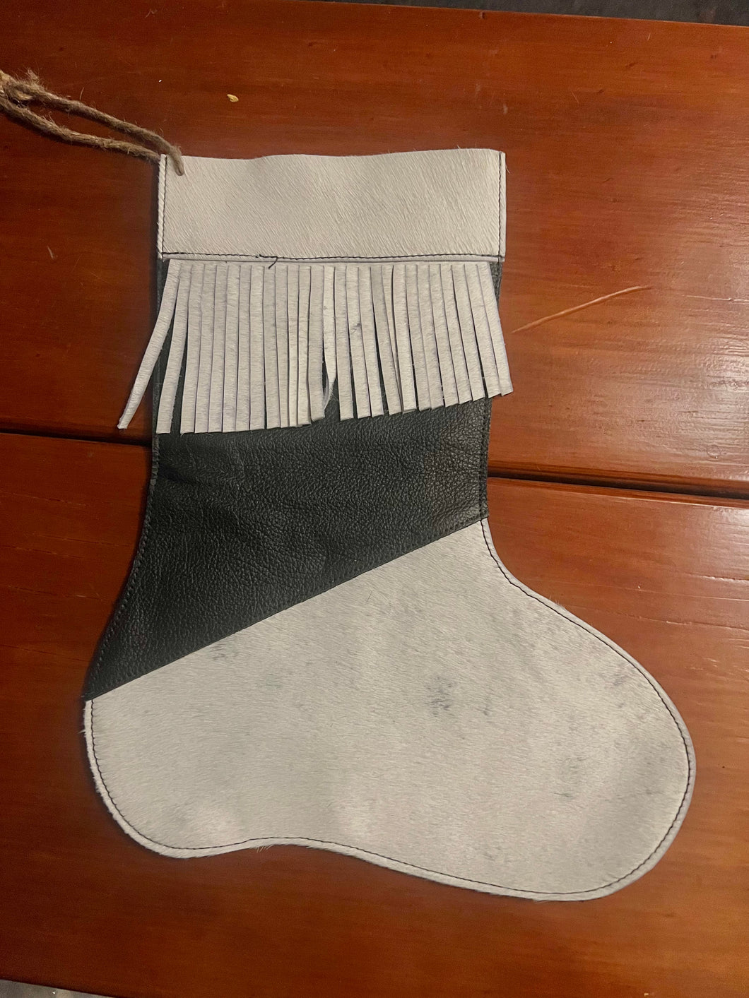 Cowhide stocking, white hide, black leather