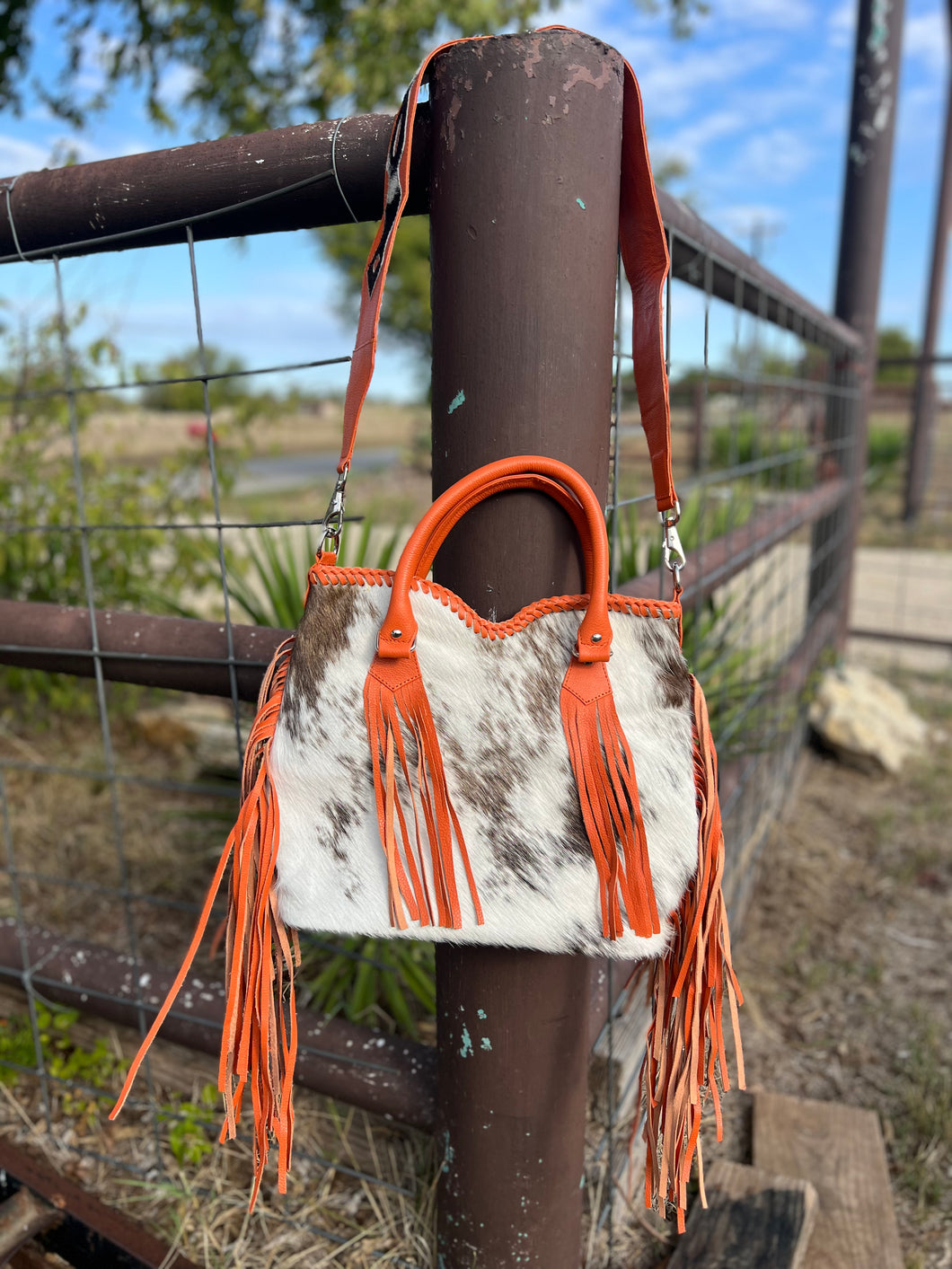 Cowhide purse/orange fringe