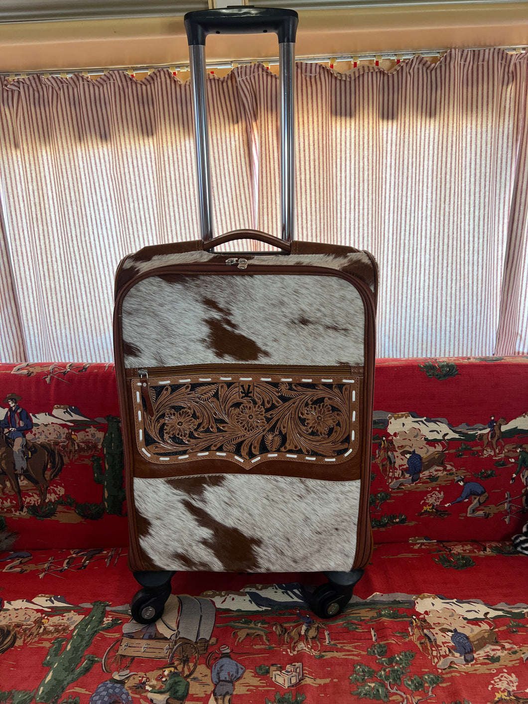 Cognac brown/white speckled cowhide rolling suitcase